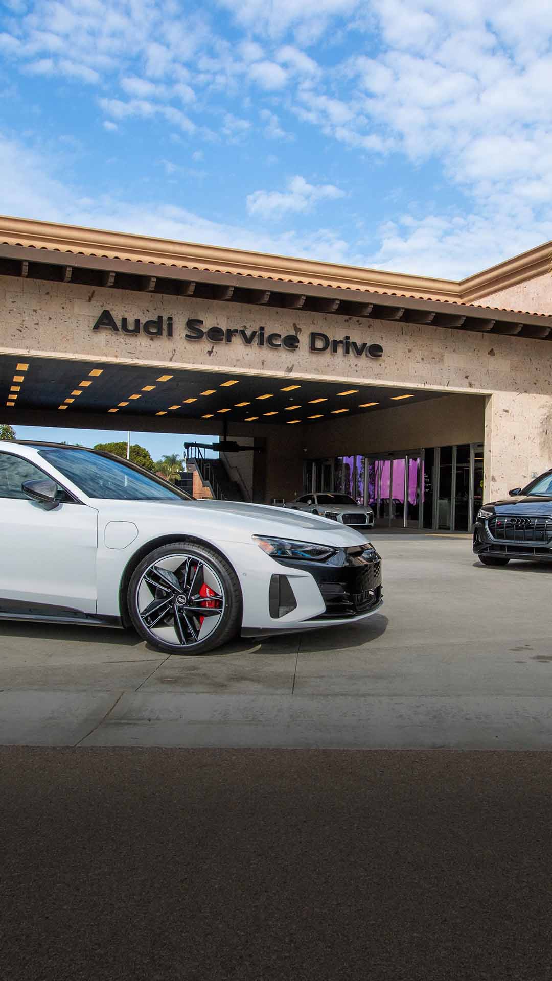 Side profile view of an Audi vehicle parked.