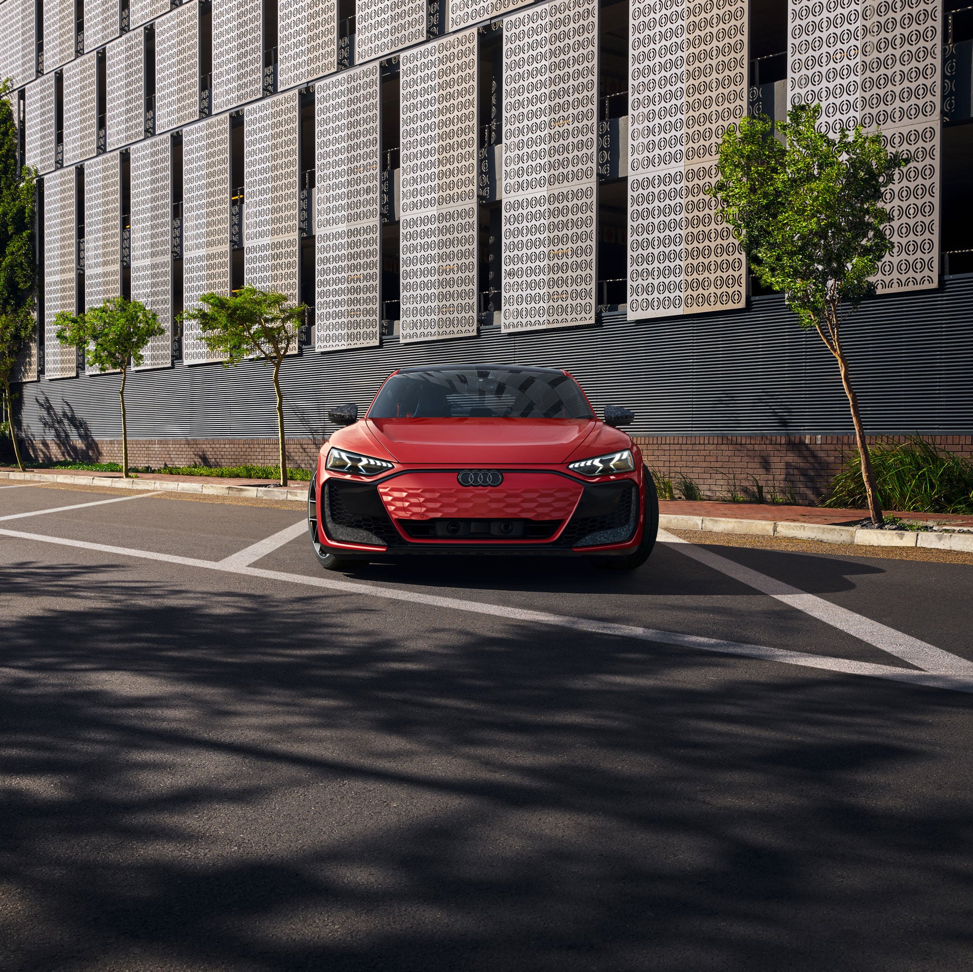 An RS e-tron GT parked on the coastline. 