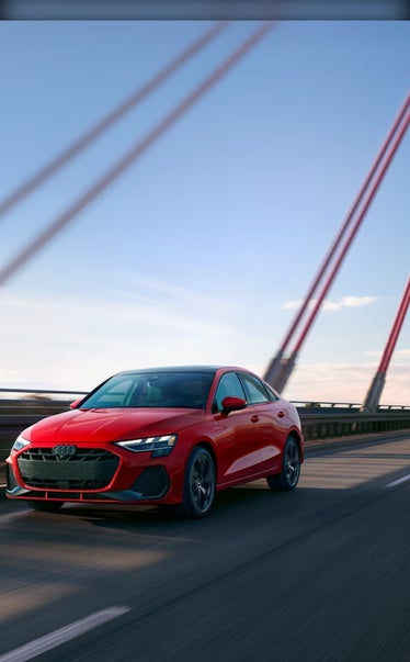 2026 Audi A3 in Progressive Red driving on an open road