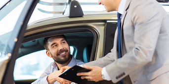 Service technician serving vehicle. 