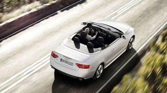 Overhead view of an Audi A5 convertible driving down the road