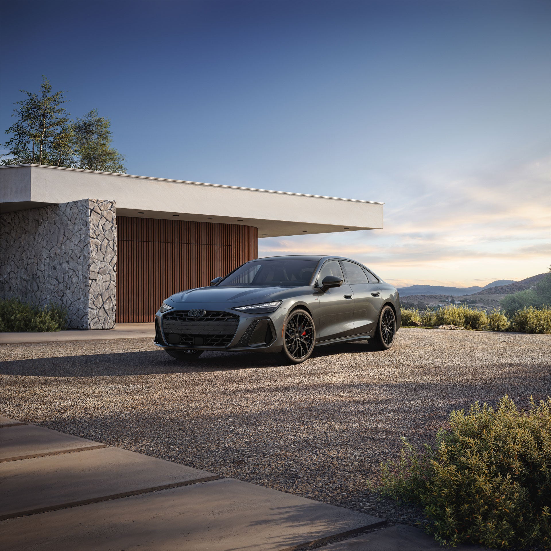 Three-quarter front view of the Audi A6 Sedan.