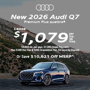 Side view of an Audi Q7 driving.