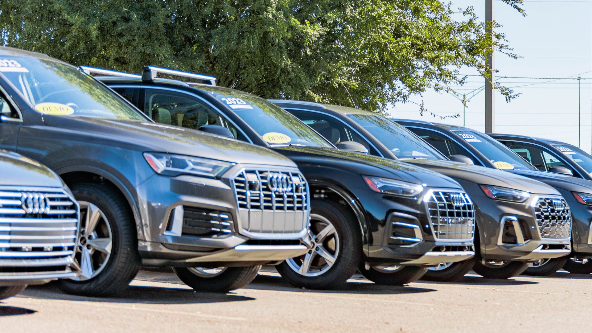 Right profile view of Audi vehicles parked.