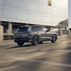 Rear 3/4 view of the Audi SQ7 in motion.
