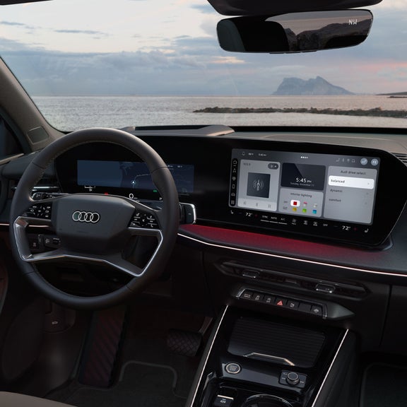 Gros plan sur le cockpit virtuel enveloppant de l'Audi Q3.