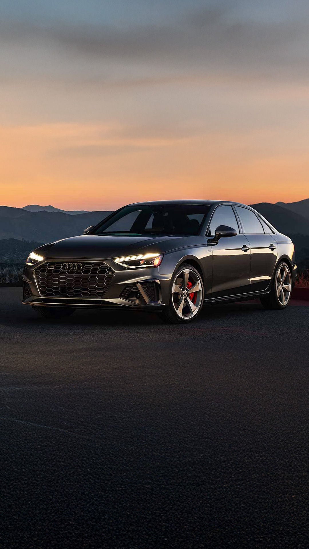 Audi parked outside at sunset