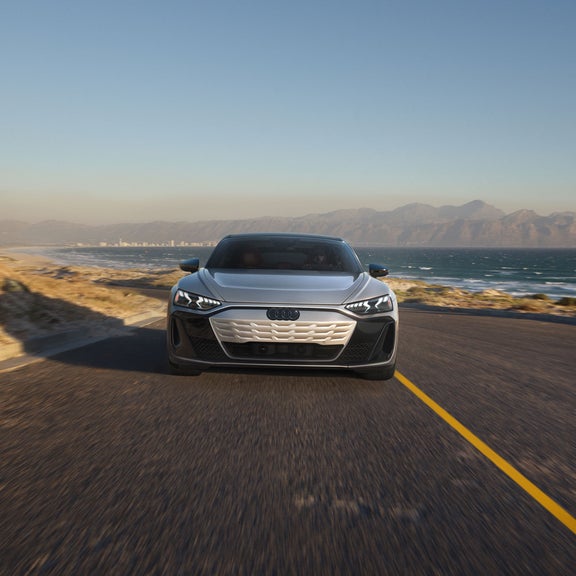 Front profile of the Audi e-tron GT accelerating. 