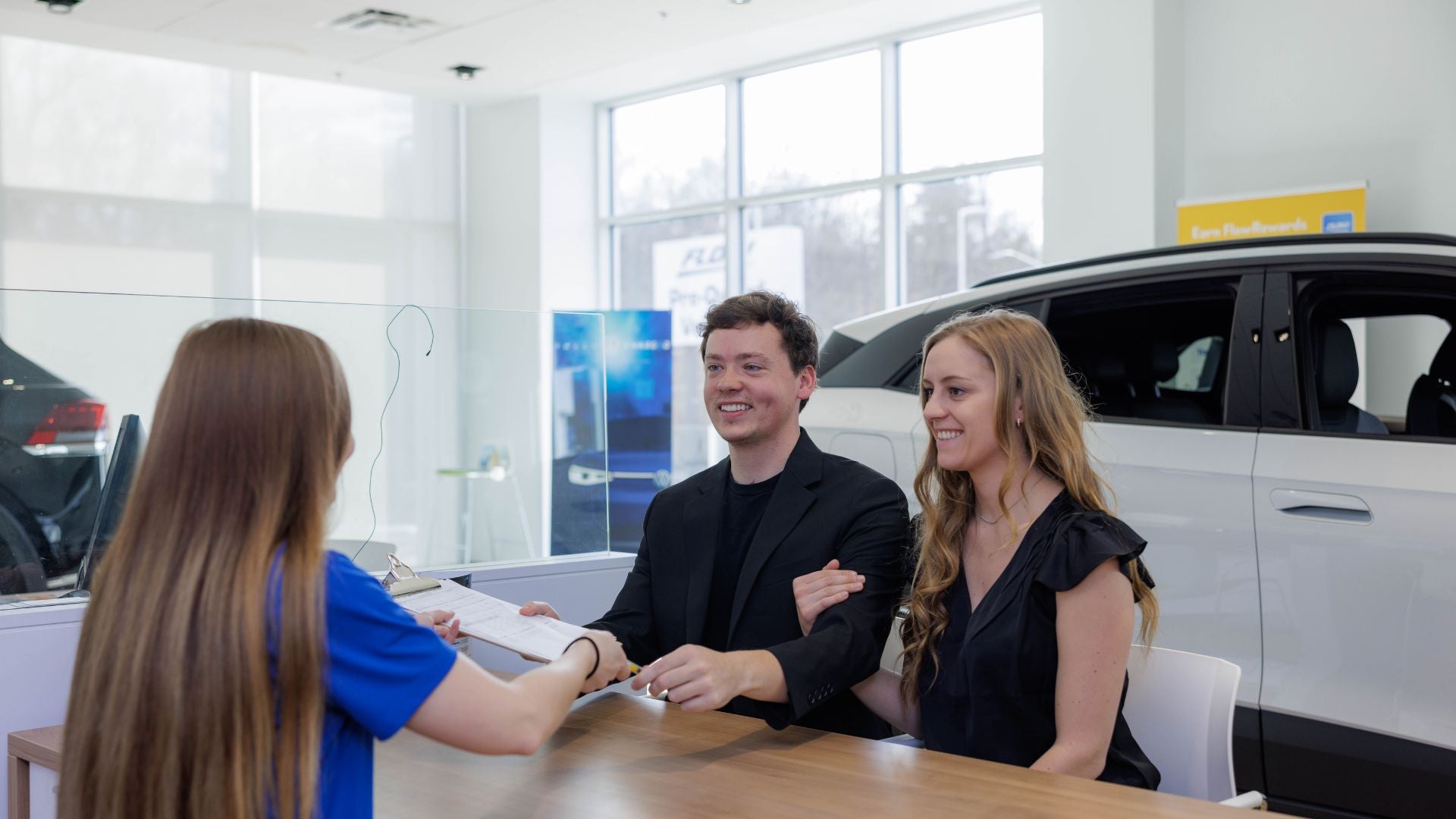 Audi sales representative working with a customer.