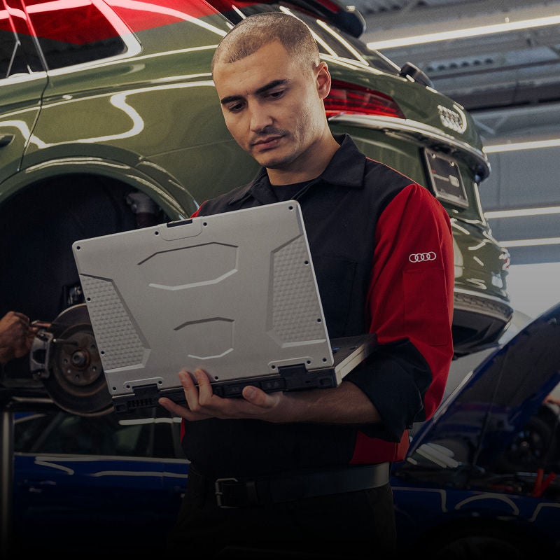 Front profile view of an Audi Q7 accelerating.