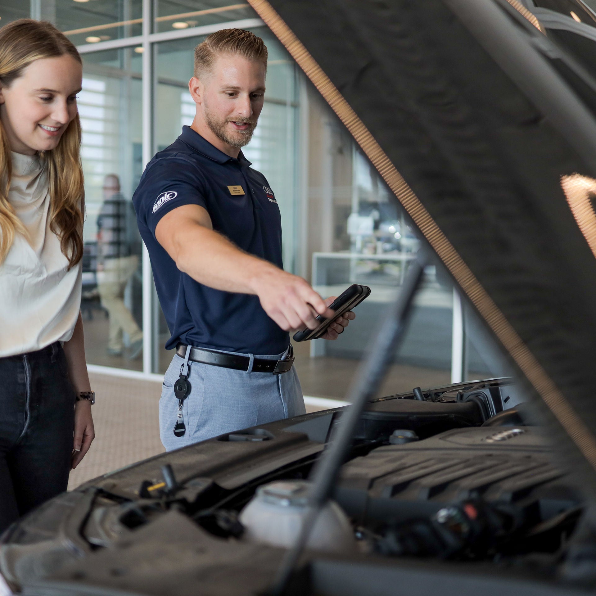Front profile view of an Audi Q7 accelerating.
