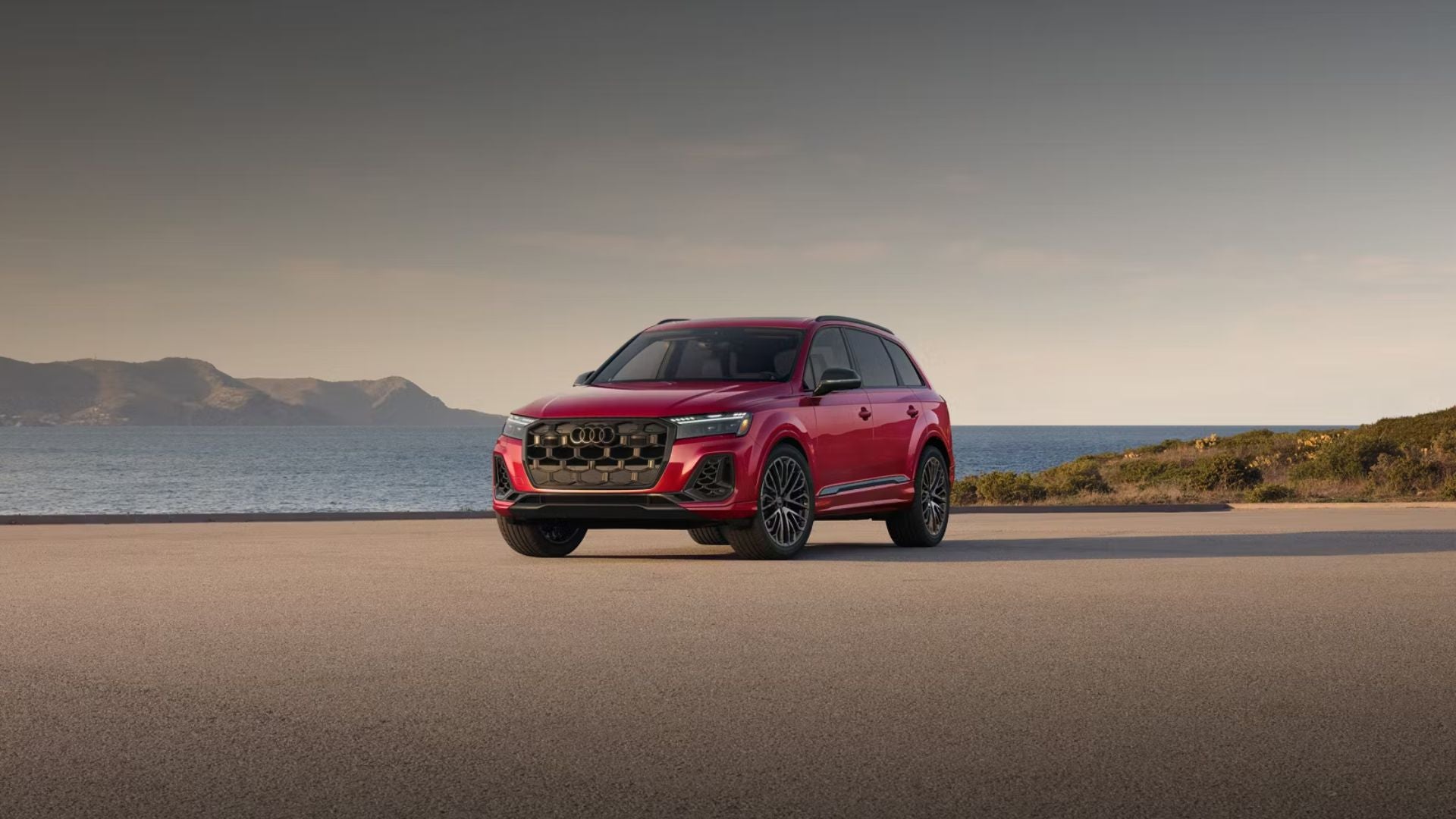 Audi SQ7 parked front view by water