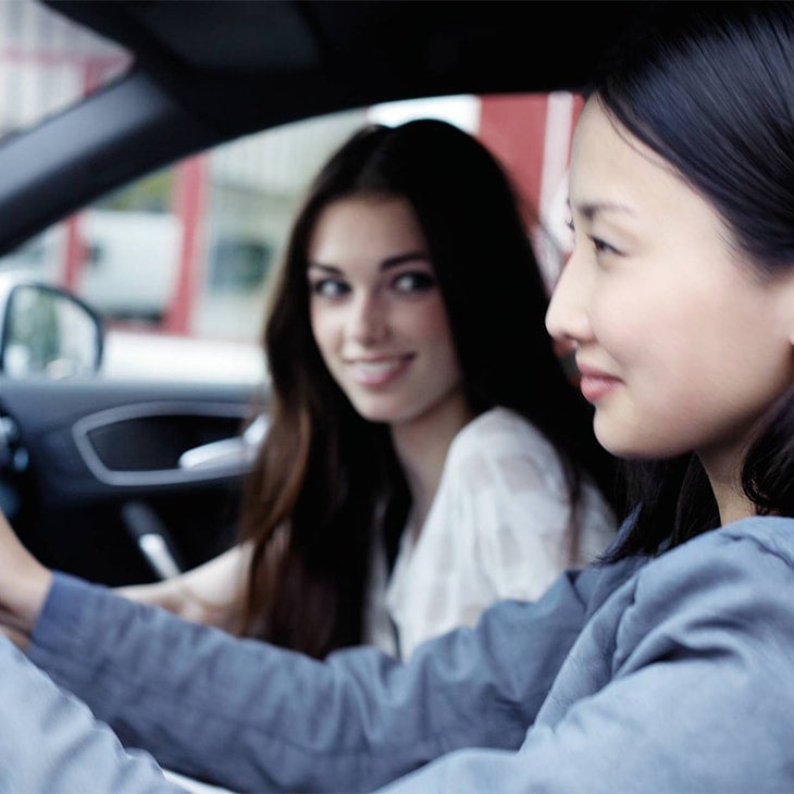 Two Audi customers driving in their vehicle bought using Audi Select. 