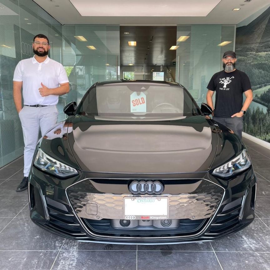image of a customer picking up their Audi RS GT