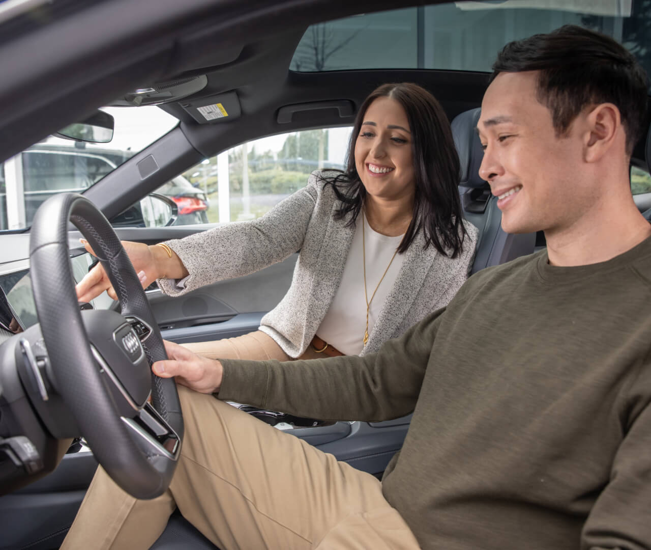 Customer behind the wheel of an Audi Vehicle