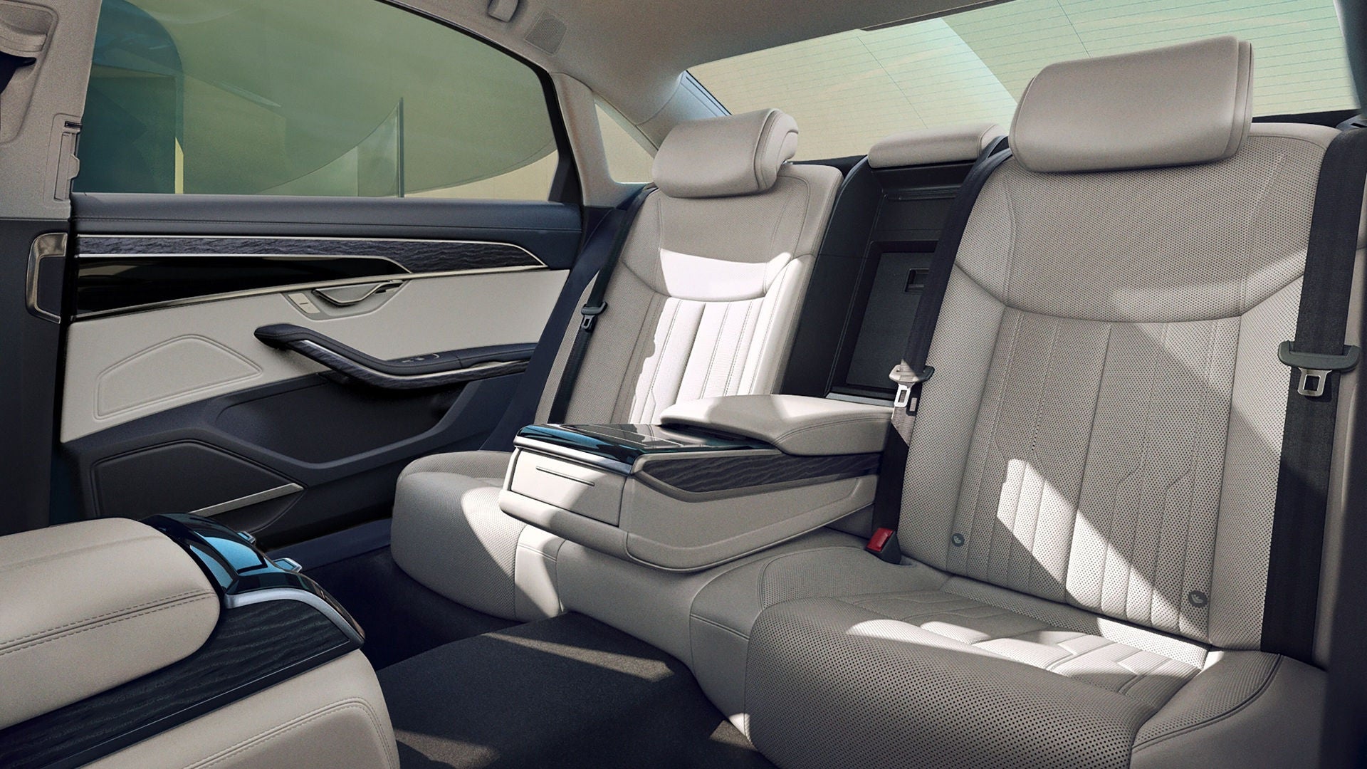 The interior of an Audi A8 showing the backseat row.  