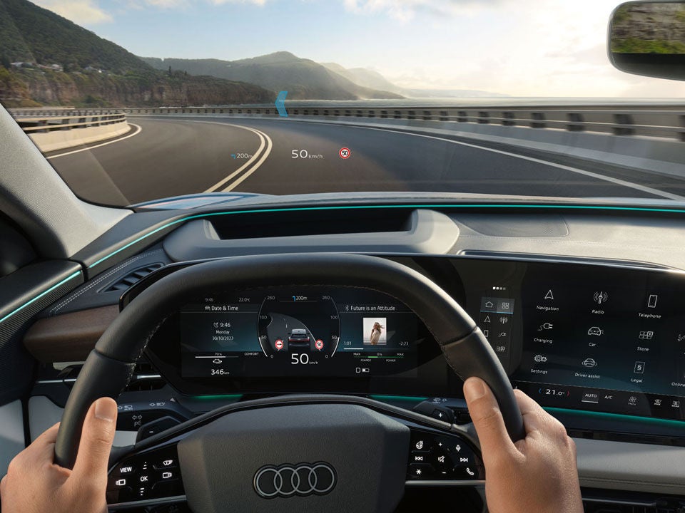 Front interior view of Audi Q6 featuring steering wheel