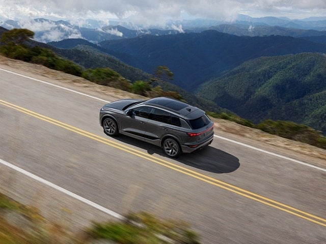 2025 Audi SQ6 e‑tron driving on mountain highway
