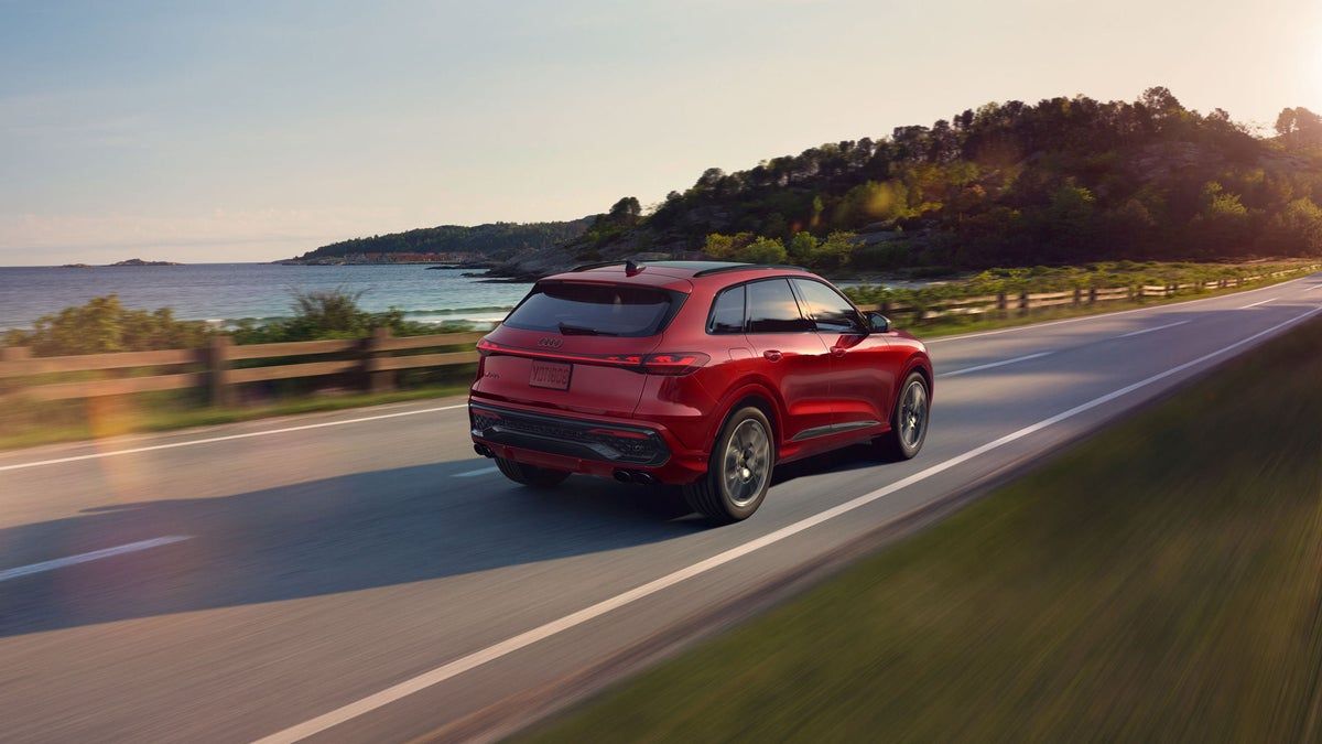 2026 Audi SQ5 driving, rear three-quarter view