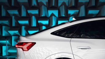 Side profile of an Audi Q8 e-tron parked.