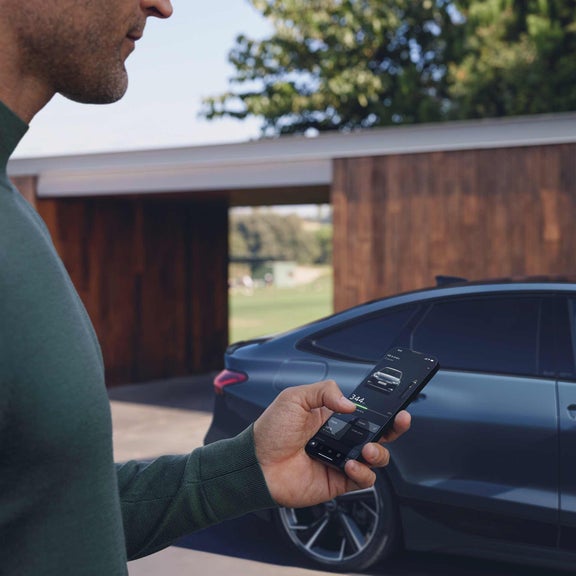 A myAudi user checking their vehicle status on the myAudi app.