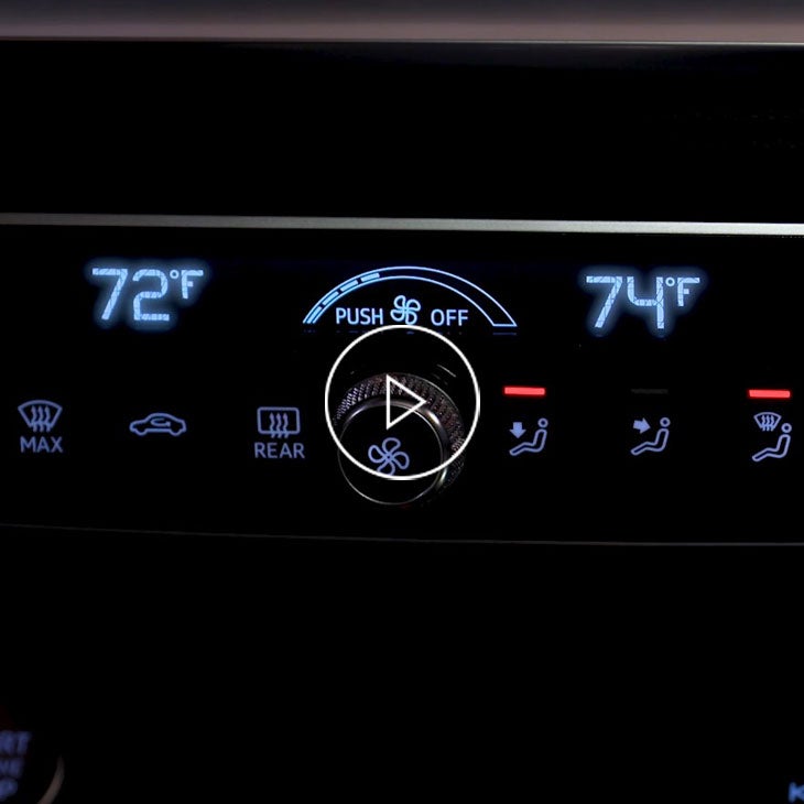  Close-up of the climate control options inside an Audi vehicle. 