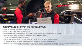 Service technician servicing tire.