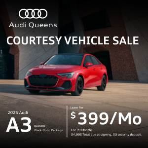 Front left view of red Audi A3 parked.