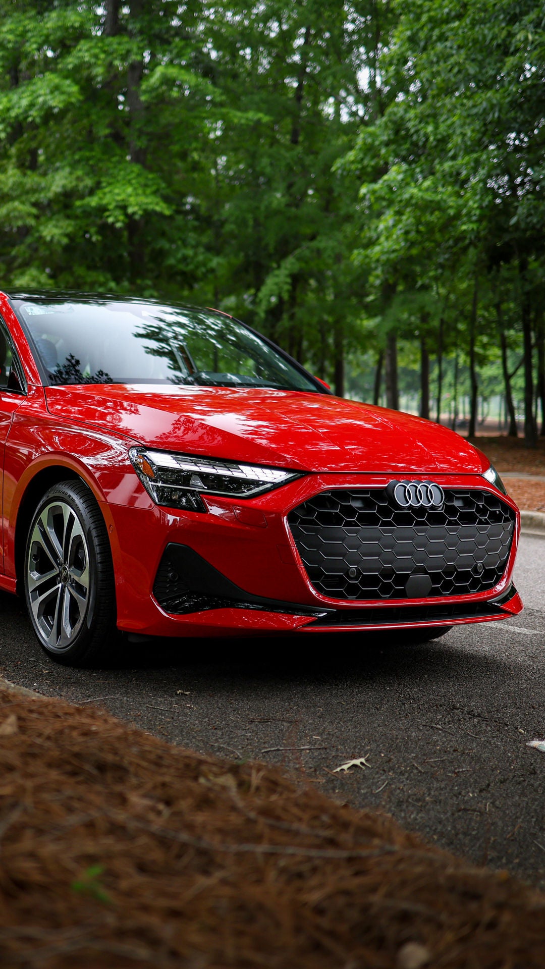 Audi 2025 Audi Q6 e-tron left profile driving.