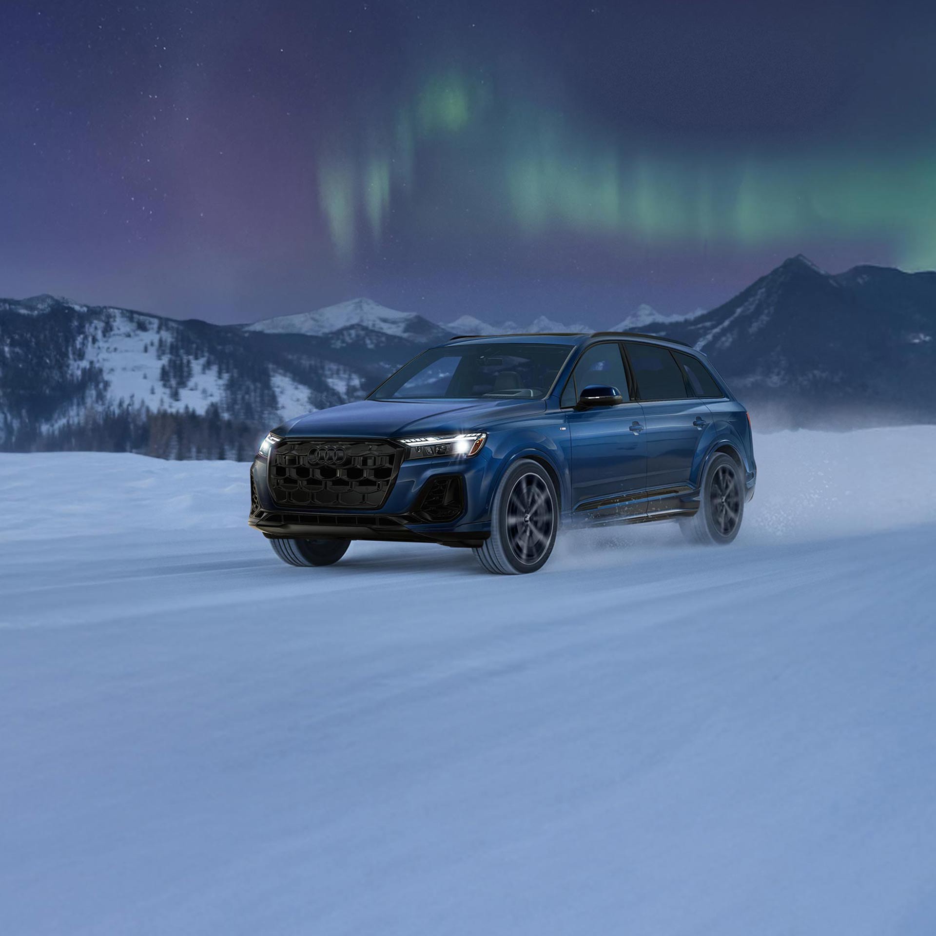 Three-quarter front profile of an Audi Q6 e-tron accelerating.