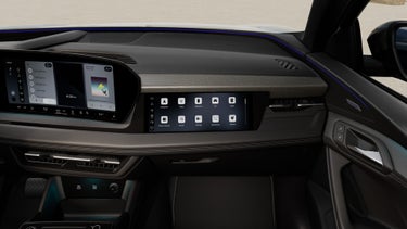 Interior view of the cockpit of the Audi Q6 Sportback e-tron, showing the passenger display screen.