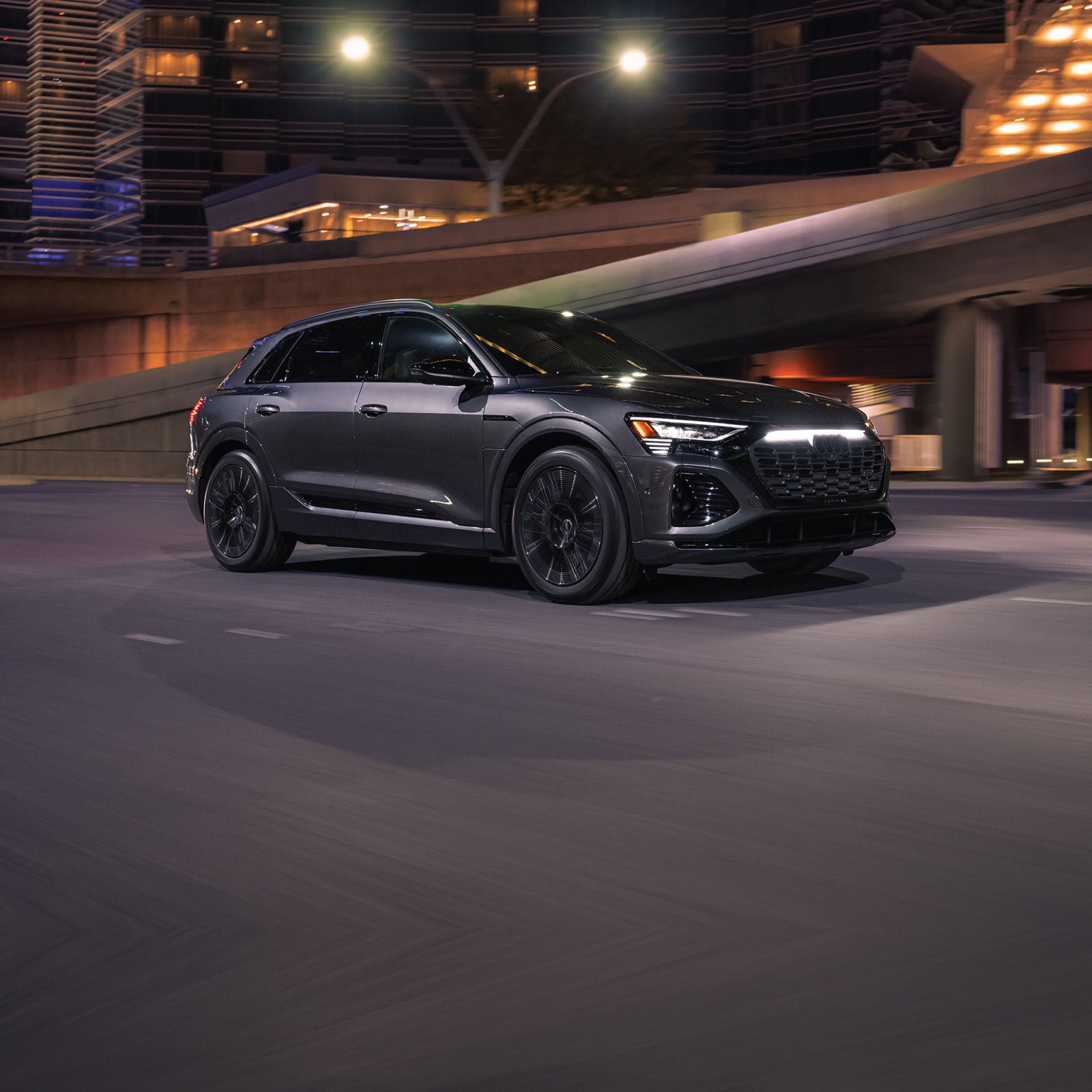 Right profile view of an Audi Q8 e-tron parked.