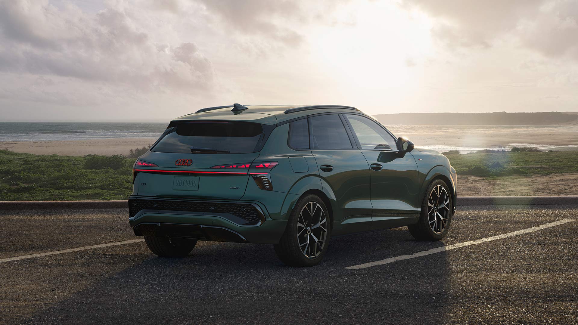 Side profile of an Audi RS e-tron GT parked in the snow. 