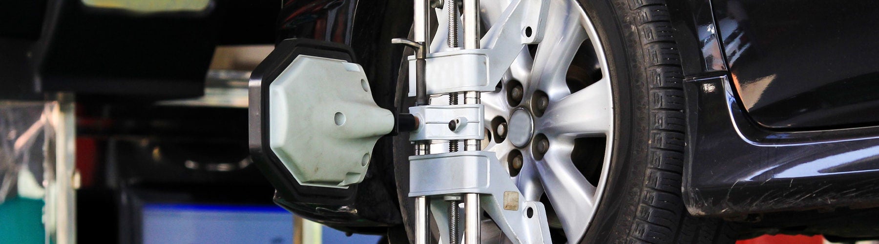 Wheel alignment service being performed at Audi