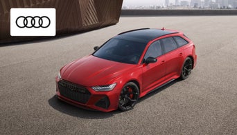 Sleek Audi coupe parked outside Audi Dayton dealership showcasing sporty design and luxury features