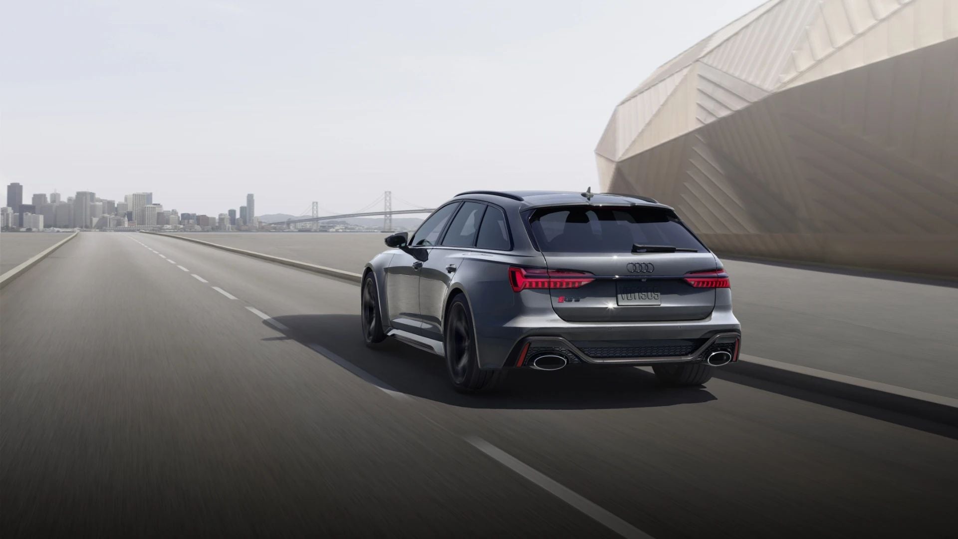 Rear view of an Audi SUV driving on the highway