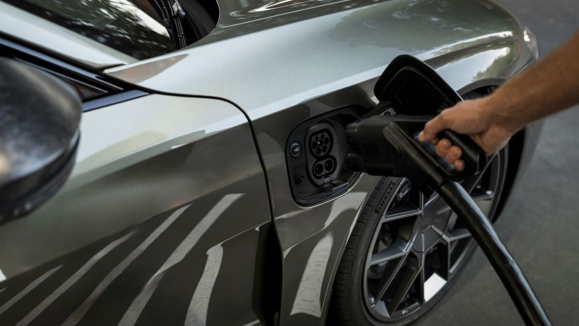 image of someone charging an audi