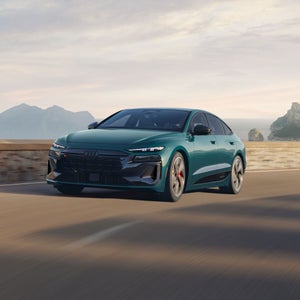 Front 3/4 view of the Audi S6 Sportback e-tron in motion.