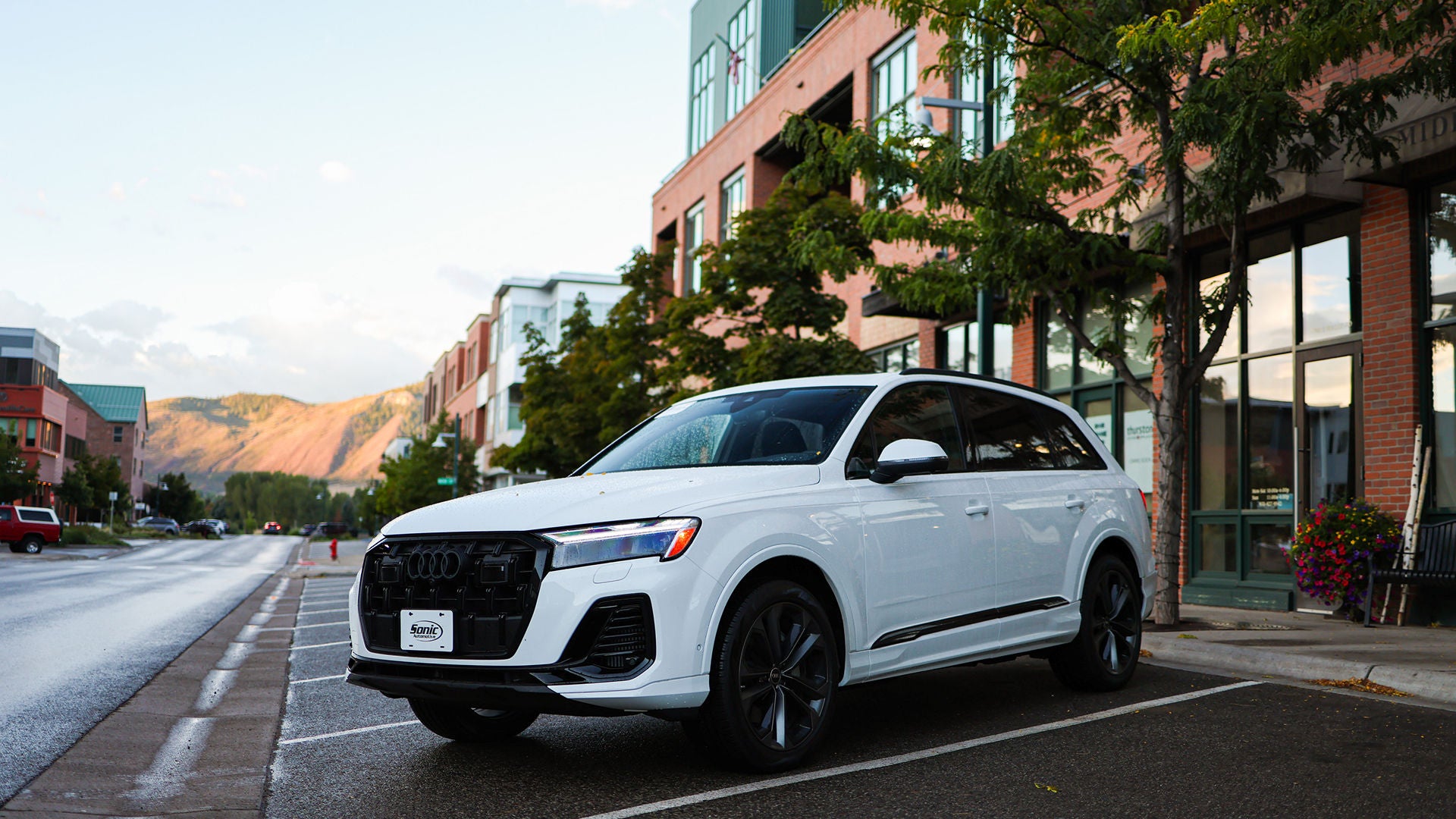 Three quarter view of an Audi q7 vehicle parked.