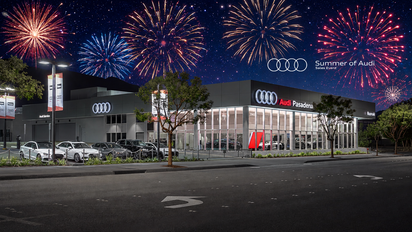 Photo of Audi Pasadena Dealership at night with fireworks in the background.