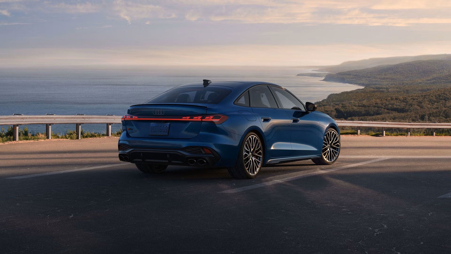 Back profile view of an Audi S5 vehicle parked.