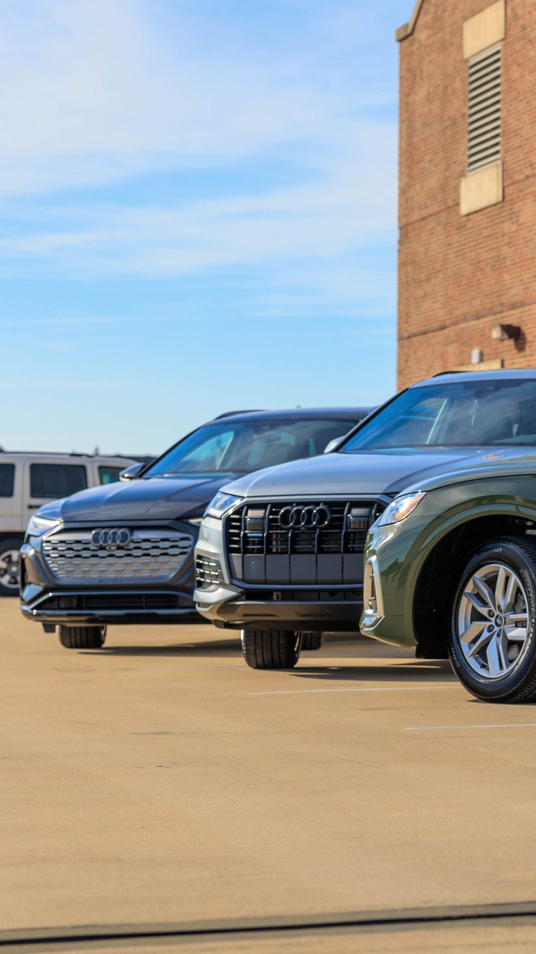 Three quarter view of an Audi parked.