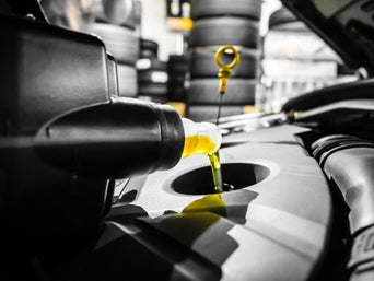 New oil being poured into a car