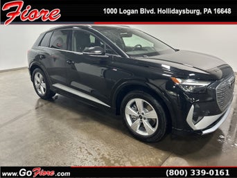 Three quarter view of an Audi Q4 e-tron parked.