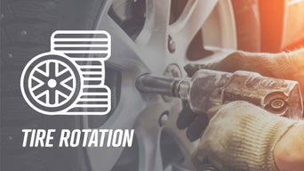 Service technician serving vehicle.