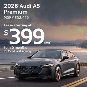 Side view of an Audi vehicle driving.