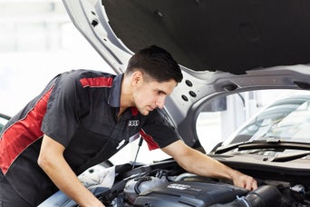 Service technician servicing engine.