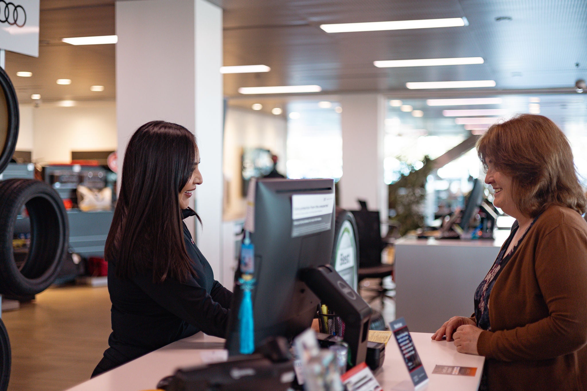 Audi customer with Audi employee in service.