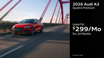 Three quarter view of an Audi A3 driving.