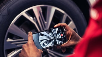 Service technician serving vehicle